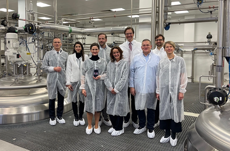 Group photo with people in protective suits (photo)