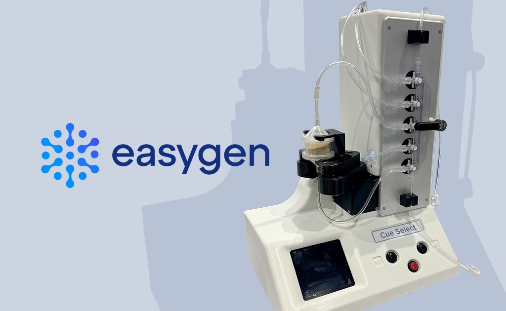 easygyn logo and laboratory device labeled “Cue Select” next to it (photo)